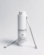 A white cylindrical cosmetic bottle labeled amerin CORRECT smoothing night eye cream, shown on a light gray studio background with two silver metal spatula tools placed beside it.